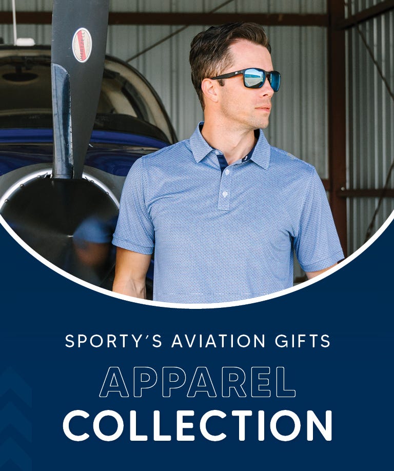 Guy in front of an airplane with a black Aerowear jacket, near Apparel Collection logo