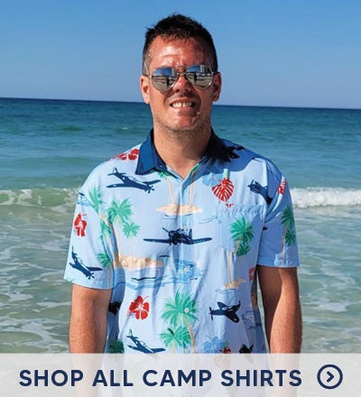 Guy wearing camp shirt on the beach